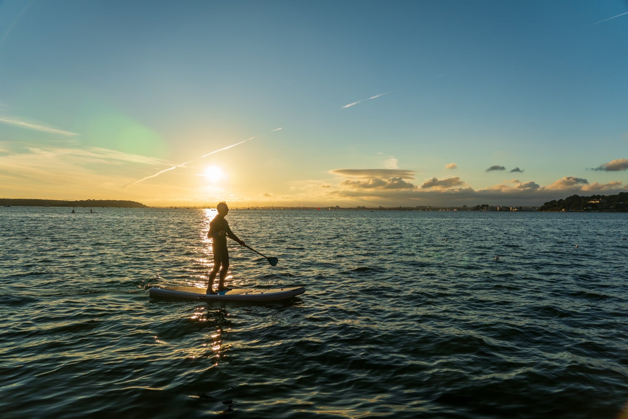 a person doing stand-up paddleboarding